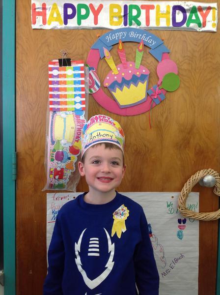 Young student wearing a birthday hat