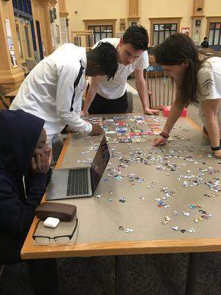 Students working on a puzzle